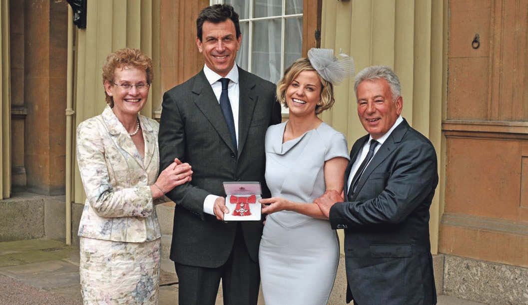 Susie Wolff celebrates MBE with family.